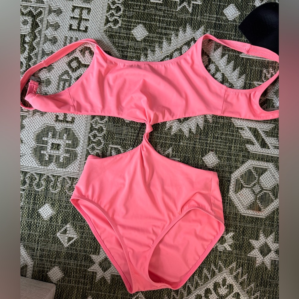 Solid and striped pink cut out bathing suit